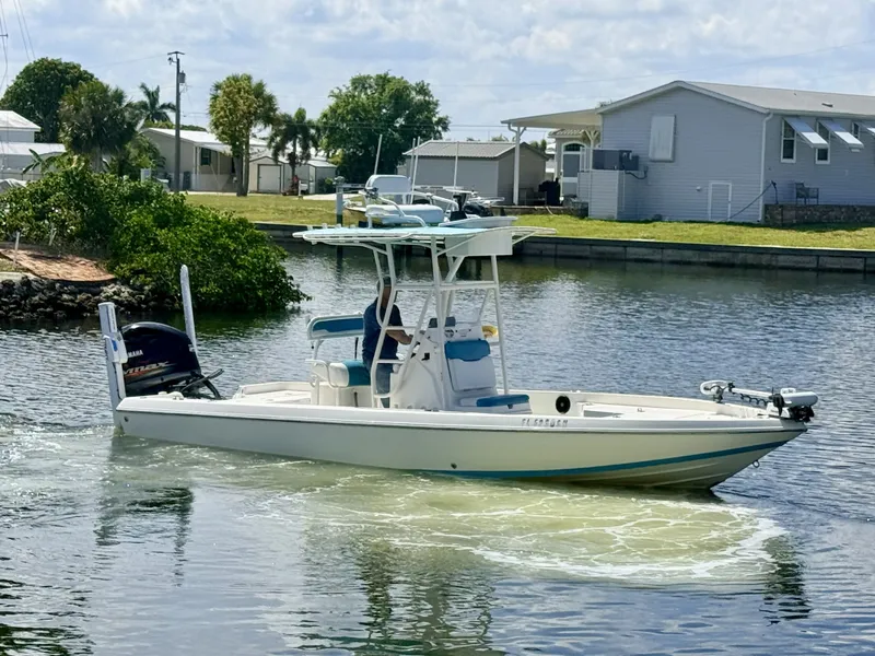 Slide: The Image of 2017 Skeeter SX230 boat on calm water. - 3