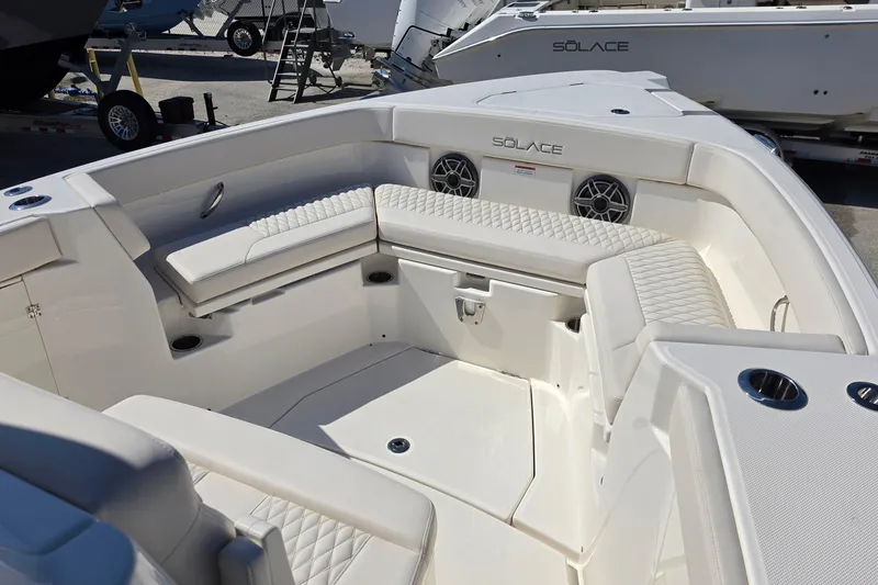 Slide: The Image of Luxurious seating area on the 2026 Solace 30CS boat, featuring elegant white upholstery. - 14