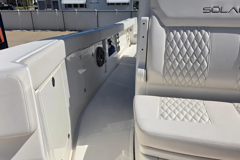 Slide: The Image of Luxurious interior of 2026 Solace 30CS boat with diamond-stitched seating and sleek design. - 17