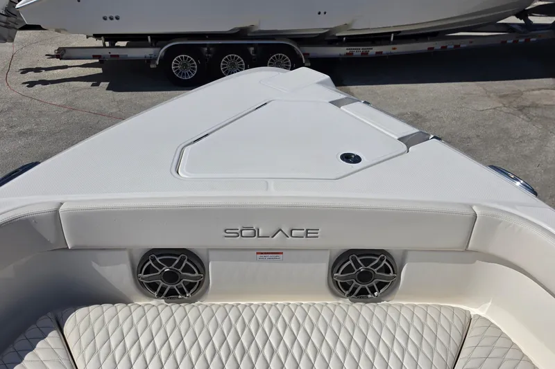 Slide: The Image of 2026 Solace 30CS boat interior with quilted seating and speaker system. - 19