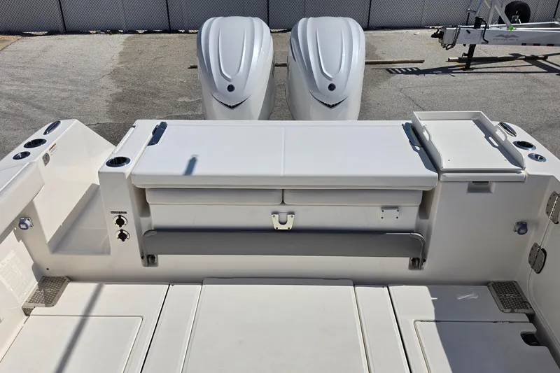 Slide: The Image of 2026 Solace 30CS boat stern with dual engines and storage compartments. - 22
