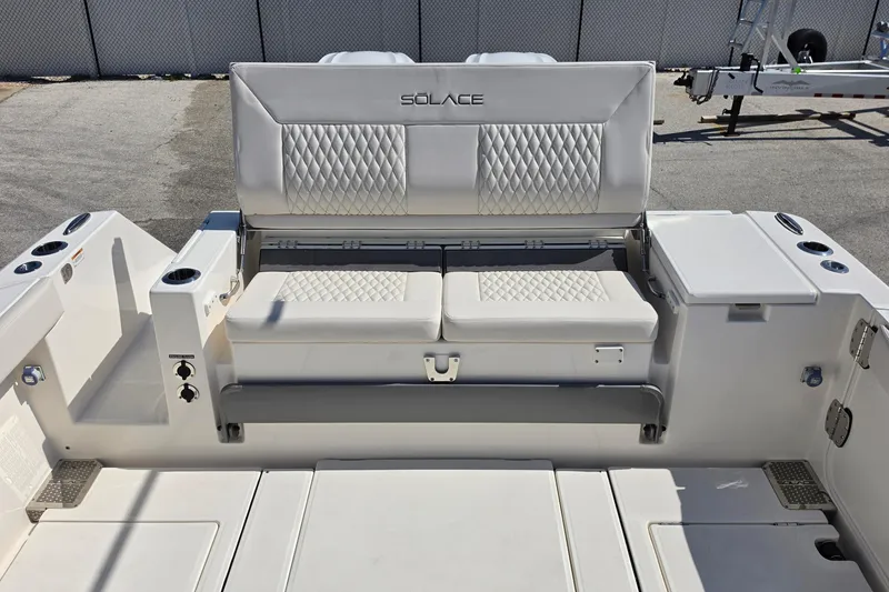 Slide: The Image of 2026 Solace 30CS boat interior with diamond-stitched seating and modern design features. - 23