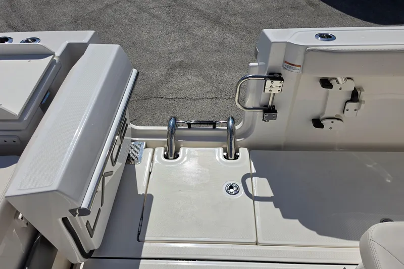 Slide: The Image of 2026 Solace 30CS boat deck with stainless steel ladder and storage compartments. - 26