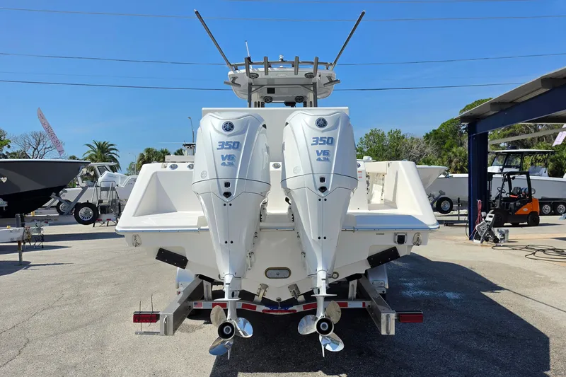 Slide: The Image of 2026 Solace 30CS boat with dual 350 V6 outboard engines, displayed outdoors. - 29