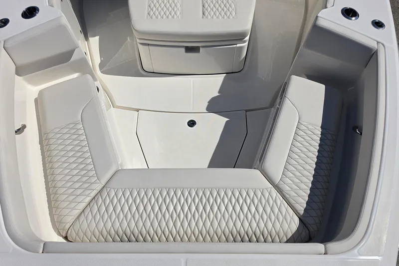 Slide: The Image of Luxurious seating area on the 2026 Solace 30CS boat with diamond-stitched upholstery. - 30