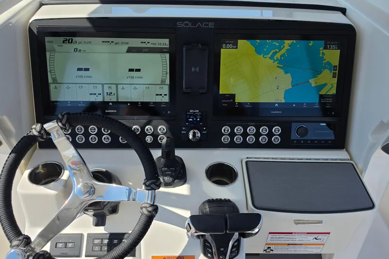 Slide: The Image of Dashboard of a 2026 Solace 30CS boat with navigation and control screens. - 8