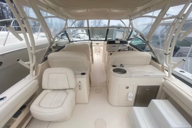 Slide: The Image of 2016 Grady-White Freedom 307 boat interior with seating and helm station. - 4