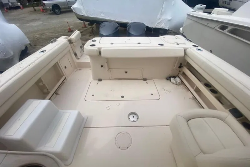 Slide: The Image of 2016 Grady-White Freedom 307 boat interior with seating and storage compartments. - 5
