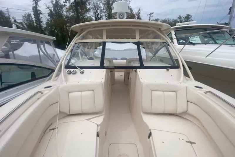 Slide: The Image of 2016 Grady-White Freedom 307 boat interior with seating and windshield. - 8