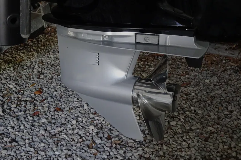 Slide: The Image of 2023 Crestliner 2000 Bay boat propeller on gravel surface. - 17