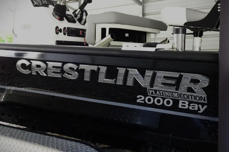 Slide: The Image of 2023 Crestliner 2000 Bay Platinum Edition boat interior with steering console. - 5