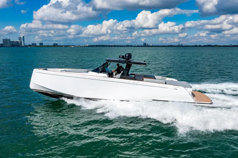 Slide: The Image of 2023 Pardo 50 yacht cruising on open water under a partly cloudy sky. - 1