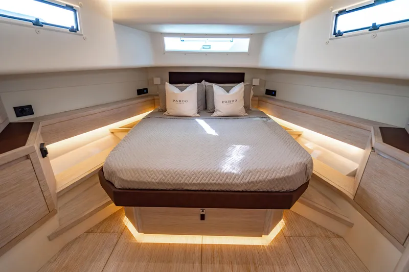 Slide: The Image of Luxurious cabin interior of 2023 Pardo 50 yacht with elegant bedding and ambient lighting. - 103
