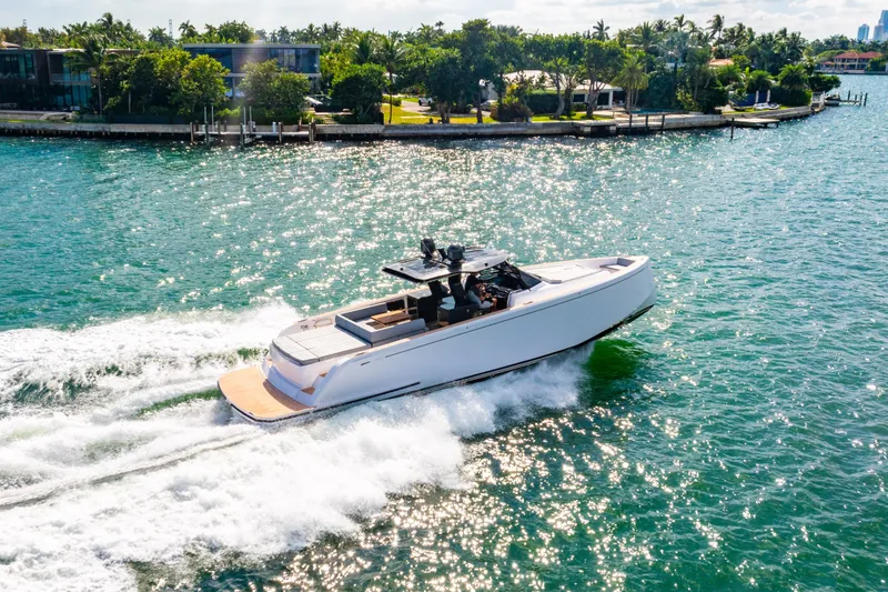 Slide: The Image of 2023 Pardo 50 yacht cruising on a sunny, scenic waterway. - 13