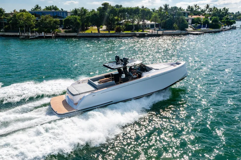 Slide: The Image of 2023 Pardo 50 yacht cruising on a sunny, tropical waterway. - 14