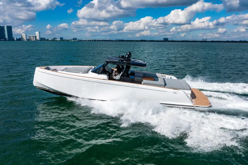 Slide: The Image of 2023 Pardo 50 yacht cruising on open water under a blue sky. - 21