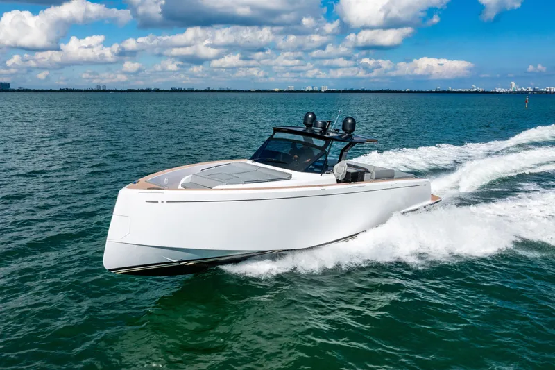 Slide: The Image of 2023 Pardo 50 yacht cruising on open water under a partly cloudy sky. - 22