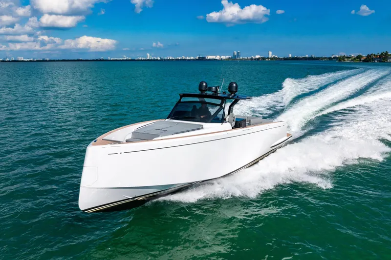 Slide: The Image of 2023 Pardo 50 yacht cruising on open water under a clear blue sky. - 29