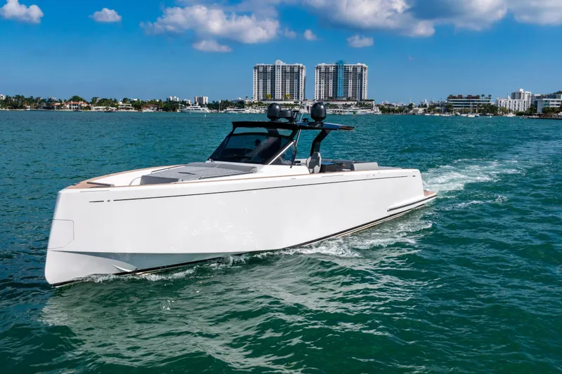 Slide: The Image of 2023 Pardo 50 yacht cruising on blue waters with city skyline backdrop. - 3