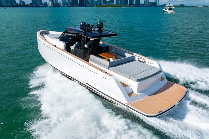Slide: The Image of Luxury 2023 Pardo 50 yacht cruising on blue waters near city skyline. - 30
