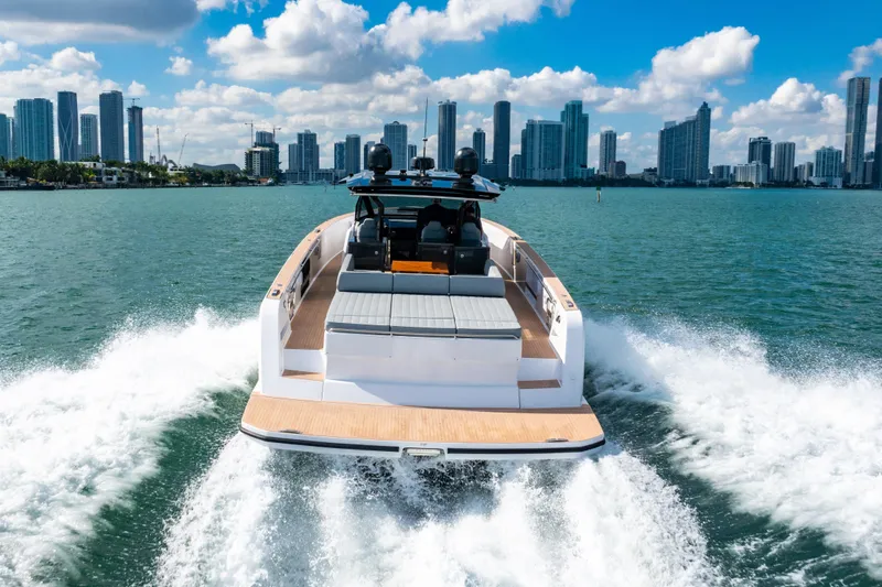 Slide: The Image of 2023 Pardo 50 yacht cruising with city skyline in the background. - 31