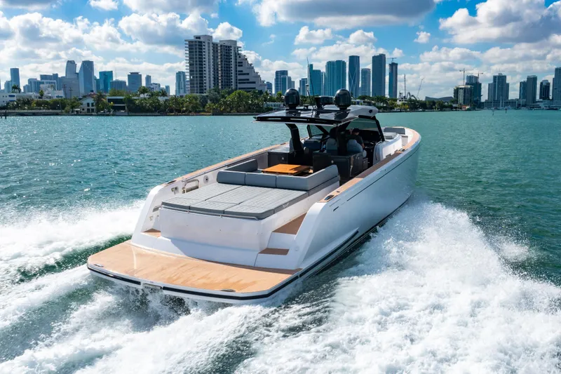 Slide: The Image of 2023 Pardo 50 yacht cruising near a city skyline on a sunny day. - 32