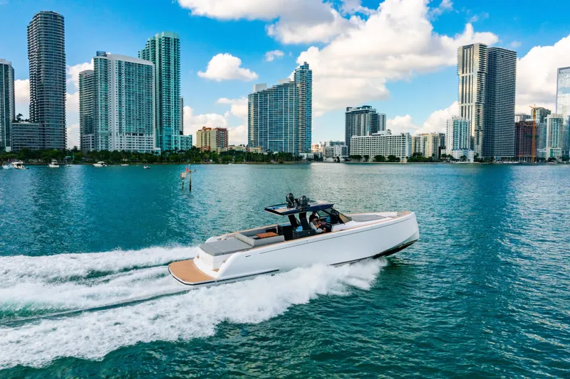 Slide: The Image of 2023 Pardo 50 yacht cruising in urban waterfront with skyscrapers in background. - 33