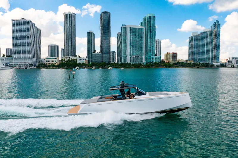 Slide: The Image of 2023 Pardo 50 yacht cruising in a city skyline backdrop with tall buildings. - 34