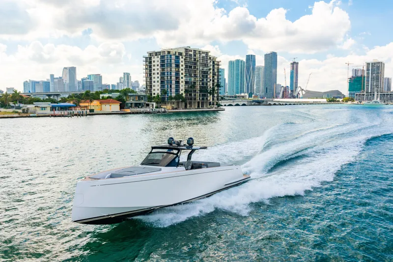 Slide: The Image of 2023 Pardo 50 yacht cruising in a vibrant city waterfront with skyscrapers in the background. - 39