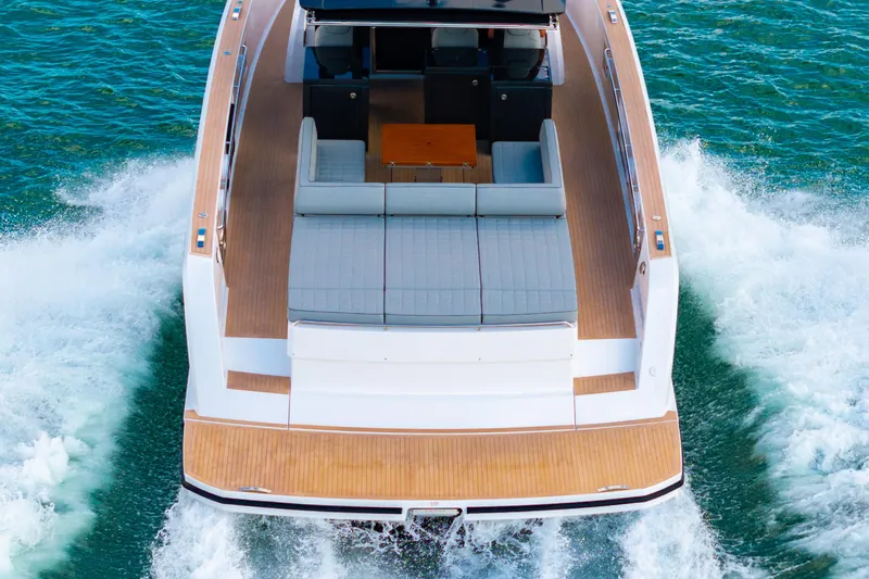 Slide: The Image of 2023 Pardo 50 yacht cruising on open water, showcasing sleek design and spacious deck. - 46