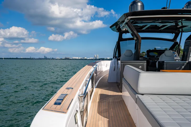 Slide: The Image of 2023 Pardo 50 yacht cruising on open water under a blue sky. - 50