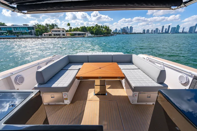 Slide: The Image of Luxury seating area on 2023 Pardo 50 yacht with waterfront city view. - 58