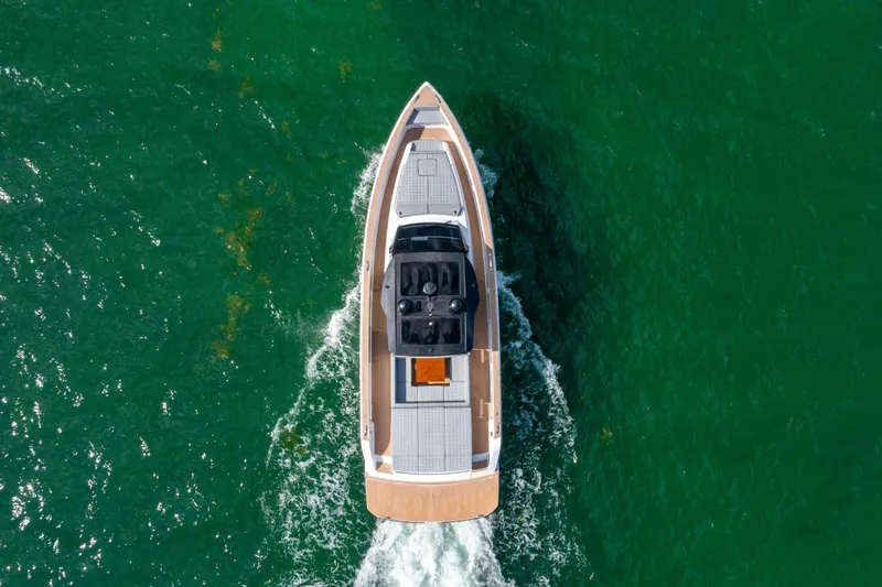 Slide: The Image of Aerial view of 2023 Pardo 50 yacht cruising on vibrant green water. - 6