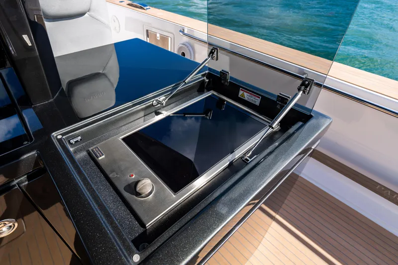 Slide: The Image of 2023 Pardo 50 yacht with sleek black cooktop and ocean view. - 61