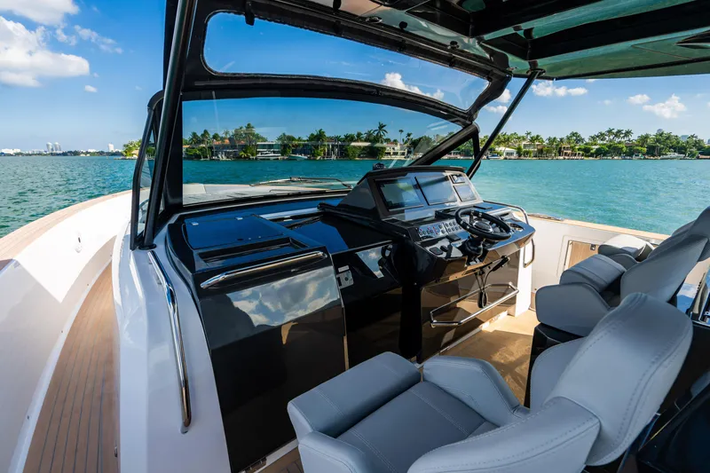 Slide: The Image of Luxurious 2023 Pardo 50 yacht cockpit with modern controls and scenic ocean view. - 67