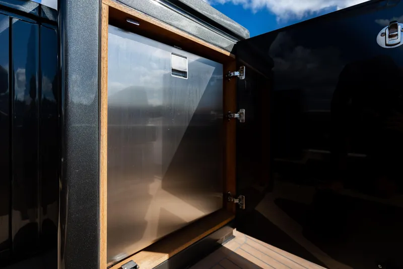 Slide: The Image of Open storage compartment on 2023 Pardo 50 yacht, featuring sleek design and stainless steel interior. - 68