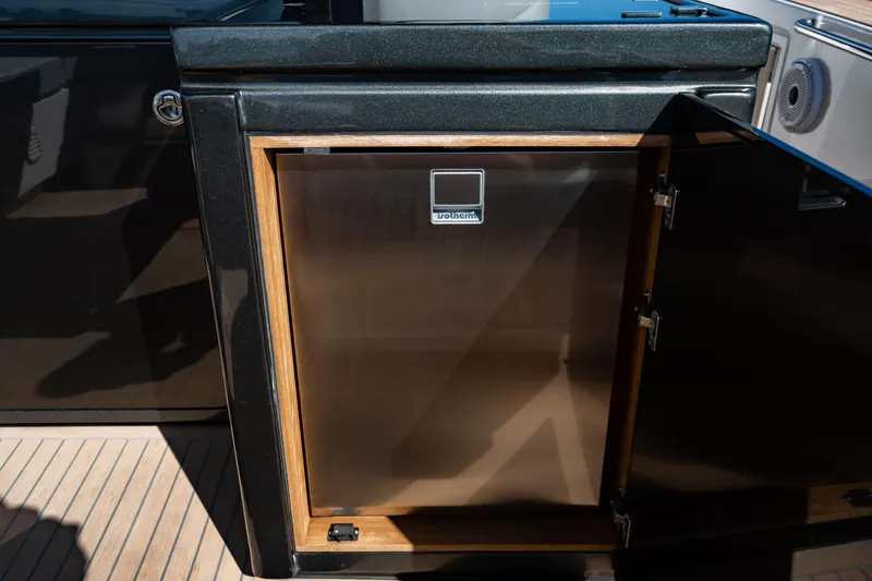 Slide: The Image of Luxury yacht Pardo 50, 2023 model, featuring a sleek built-in Isotherm refrigerator. - 69