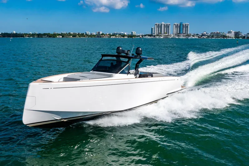 Slide: The Image of 2023 Pardo 50 yacht cruising on blue water with city skyline in background. - 7