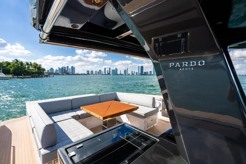 Slide: The Image of Luxurious 2023 Pardo 50 yacht with elegant seating, overlooking a vibrant city skyline. - 72