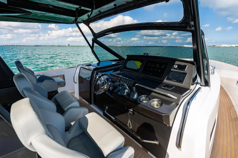 Slide: The Image of Luxury helm of 2023 Pardo 50 yacht with modern controls and ocean view. - 76