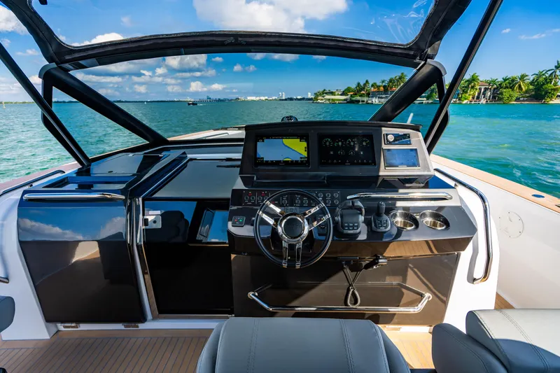 Slide: The Image of Cockpit of 2023 Pardo 50 yacht with modern navigation system and ocean view. - 78