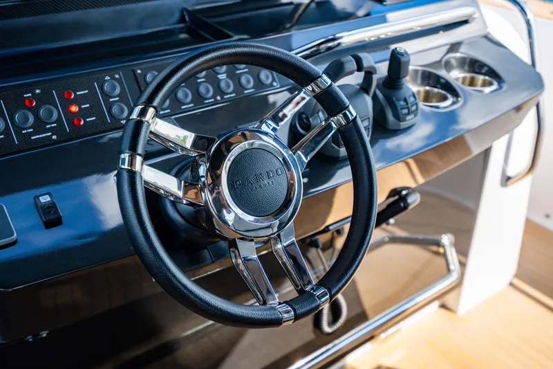 Slide: The Image of Steering wheel of 2023 Pardo 50 yacht, featuring sleek controls and modern design. - 80