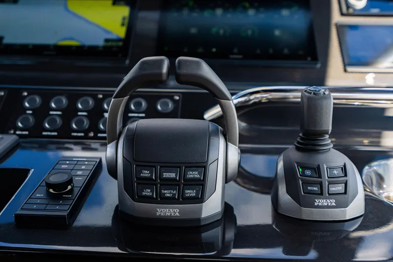 Slide: The Image of Control panel of a 2023 Pardo 50 yacht featuring Volvo Penta throttle and joystick. - 84