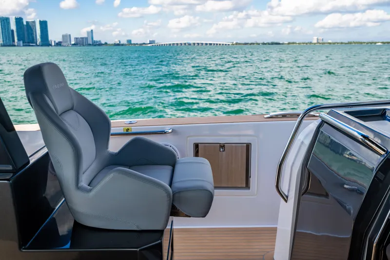 Slide: The Image of Luxury seating on 2023 Pardo 50 yacht with ocean view and city skyline. - 85