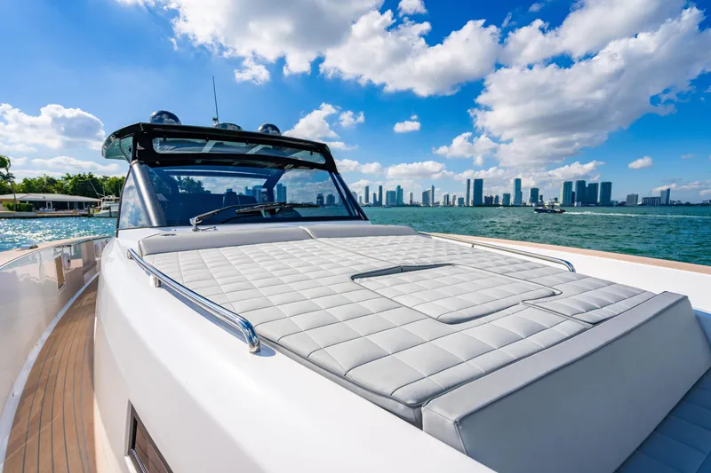 Slide: The Image of 2023 Pardo 50 yacht cruising with city skyline in the background. - 91