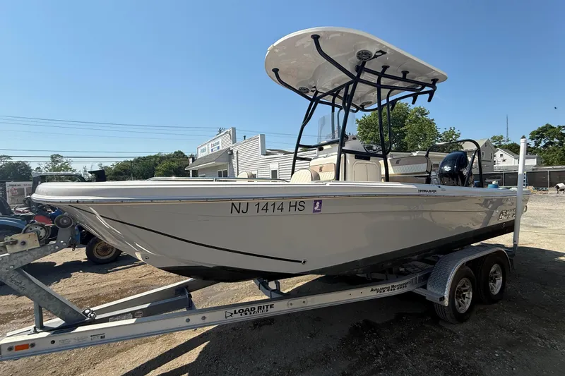 The Image of 2023 Carolina Skiff 21 Ultra Elite boat on trailer, side view. - 1