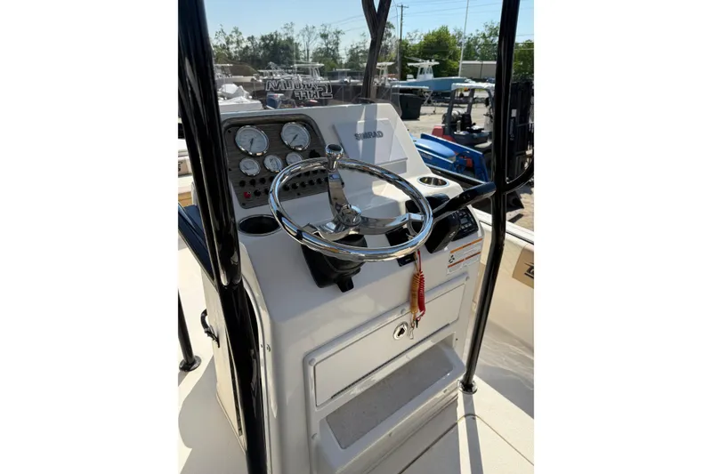 Slide: The Image of 2023 Carolina Skiff 21 Ultra Elite boat console with steering wheel and gauges. - 5