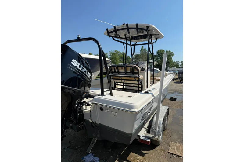 Slide: The Image of 2023 Carolina Skiff 21 Ultra Elite boat with Suzuki engine on trailer. - 9