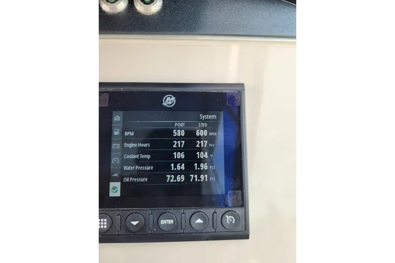 Slide: The Image of Dashboard display of a 2021 Boston Whaler 320 Vantage showing engine metrics. - 12