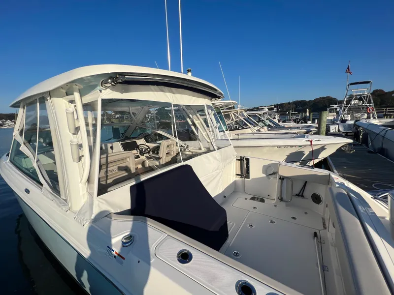 Slide: The Image of Boston Whaler 320 Vantage 2021 docked under sunny skies. - 4